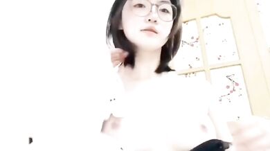 Innocent glasses girl takes sexy selfie in pajamas