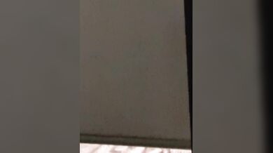 Neighbor accidentally exposes herself while closing window naked