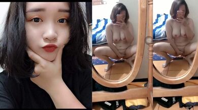 Busty Short-Haired Girl Strips Nude Before Mirror