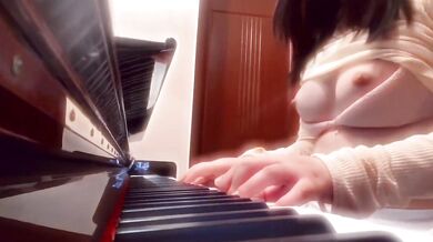 Playing Piano and Singing in a Revealing Outfit