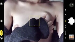 Short-haired girl plays with vibrator on the floor