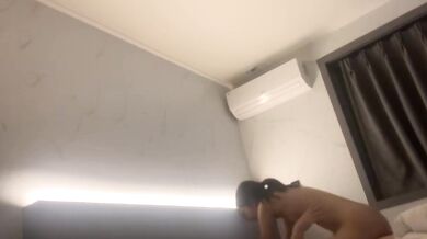 Korean couple takes selfie in hotel