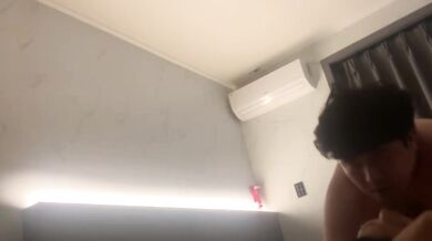 Korean couple takes selfie in hotel