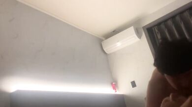 Korean couple takes selfie in hotel