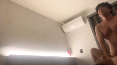 Korean couple takes selfie in hotel