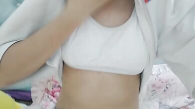 Cute sister touches breasts in bedroom