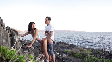 Foreign couple taking selfies at the beach