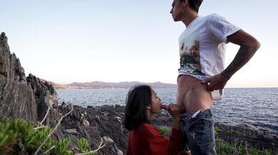 Foreign couple taking selfies at the beach